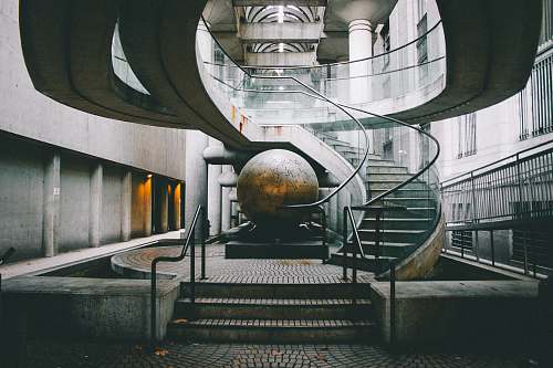 san francisco landscape photography of grey staircase with globe under embarcadero center